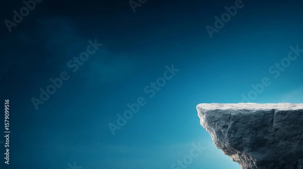 Obraz Rugged cliff edge stands against serene blue sky, evoking sense of tranquility and isolation