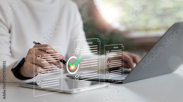 Obraz Businesswoman approving digital invoice on tablet and laptop with financial document icons. Concept of paperless billing, e-invoice management, and online finance workflow.