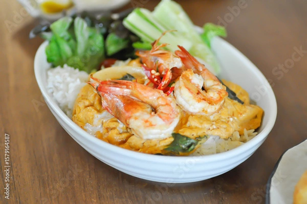Fototapeta creamy omelet or omelet or omelette or fried egg with shrimp and squid or seafood omelette and rice