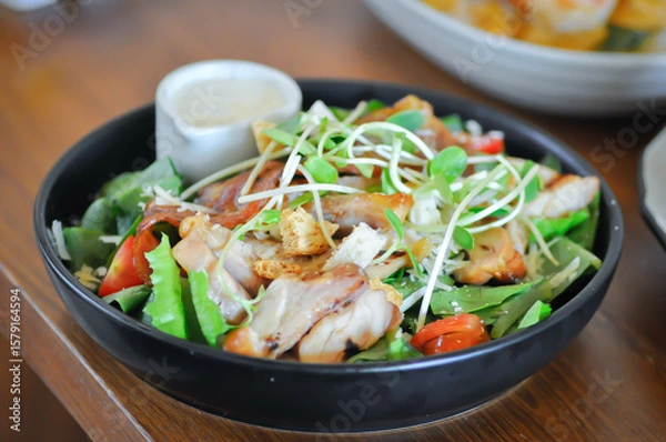 Fototapeta pork salad or grilled pork salad or caesar salad or vegetable salad with pork