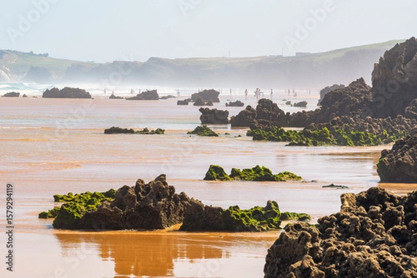 Fototapeta A beach of golden sand and rock formations of mind-blowing shapes in the north of Spain, Costa Quebrada.
