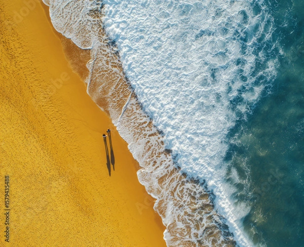 Fototapeta Aerial view of the beach with waves and sand. Bright ocean beach and water.