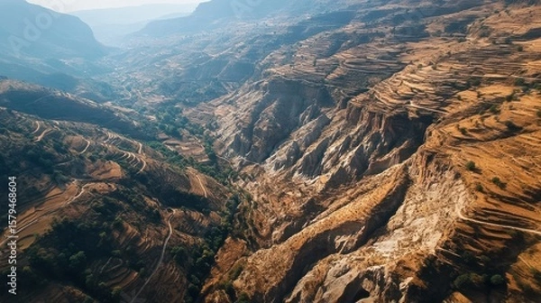 Fototapeta High-altitude view of a rugged valley
