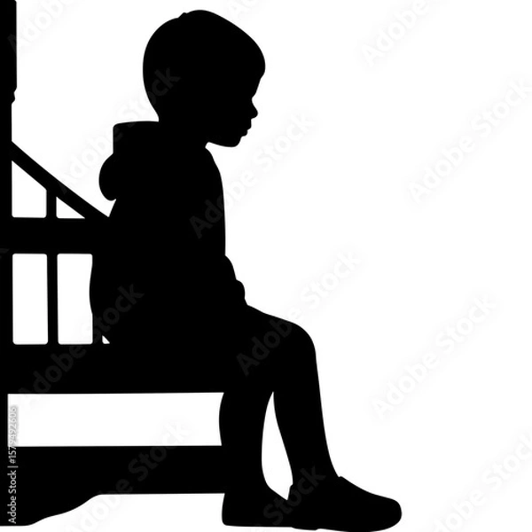 Fototapeta Silhouette of a child sitting on steps in a contemplative pose  