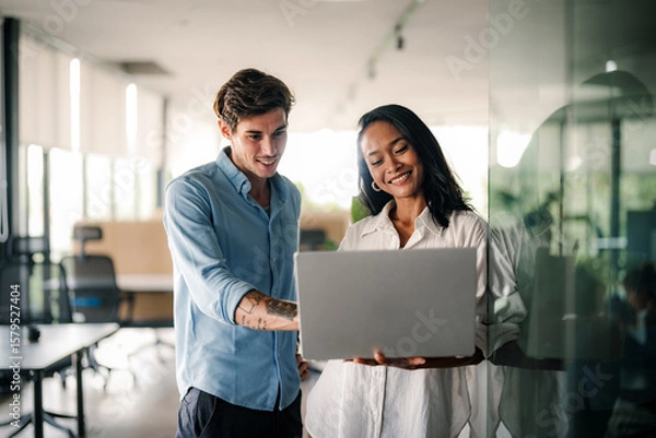 Fototapeta Two happy diverse multiethnic business team people working, talking in corporate office