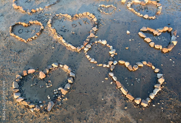 Obraz Stones on the beach laid out by lovers in the shape of hearts
