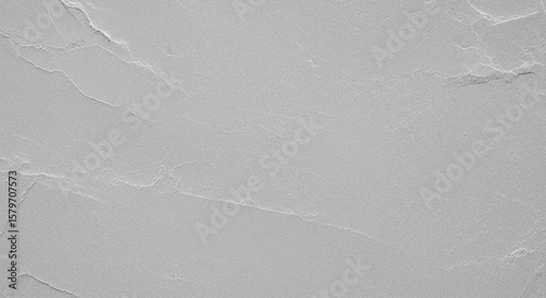 Fototapeta Textured gray surface with subtle, irregular creases and folds, resembling crumpled paper or stone.