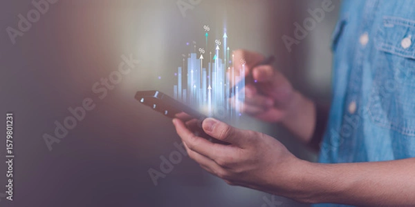 Fototapeta Businessman showing business growth and success graph ,concept of progress in development, financial efficiency and investment with business strategy for goals and opportunities in the industry future