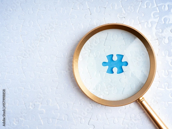 Obraz HR, human resources, recruitment and hiring, problem solving solution, business strategy concept. Blue space for last missing piece, focus in magnifying glass lens, on white jigsaw puzzle background.