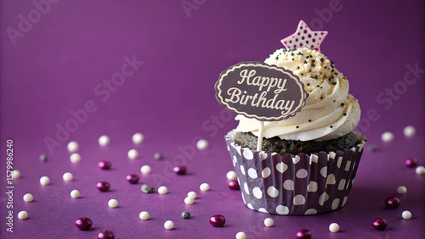 Fototapeta Festive Cupcake Celebration: A single, artistically crafted cupcake, adorned with "Happy Birthday" and a star topper, takes center stage against a vibrant backdrop. This image exudes joy. 