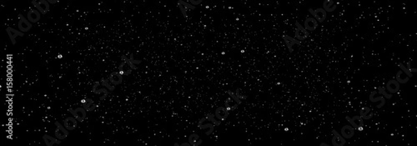 Fototapeta panoramic view beautiful water drop frozen in time, black background, panoramic view water fountain in slow motion, magic raindrop freez