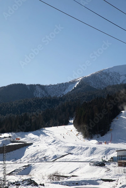 Obraz Snowboarders and skiers ski in the ski resort on the slopes