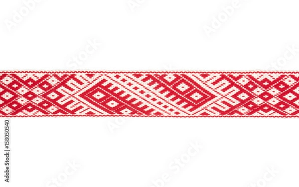 Fototapeta Lielvardes (name of the place in Latvia) traditional belt with historical ornaments.Belt of Lielvarde is most magnificent Latvia’s ethnographic belt which symbols are associated with countless legends