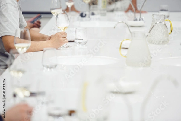 Fototapeta Different glasses with wine on the table, close up. Sommelier school, wine waiter certification. Association of professional winemaker.
