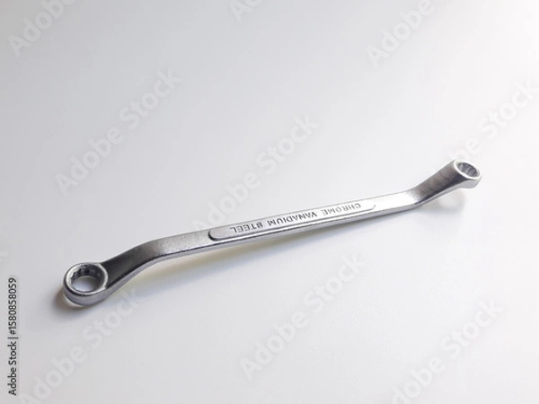 Fototapeta Ring wrench or also known as offset ring wrench and box-end wrench, isolated on white background.