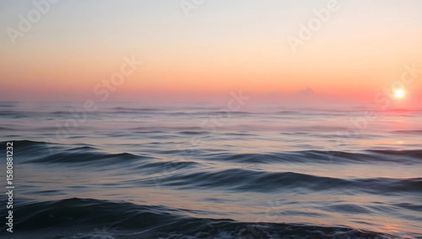 Fototapeta Ocean Calm – Gentle waves and a pink sunset