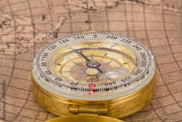 Fototapeta Compass on old map as background.