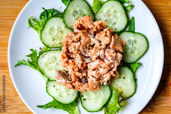 Fototapeta Red Salmon Fish With Cucumber and Salad Leaves
