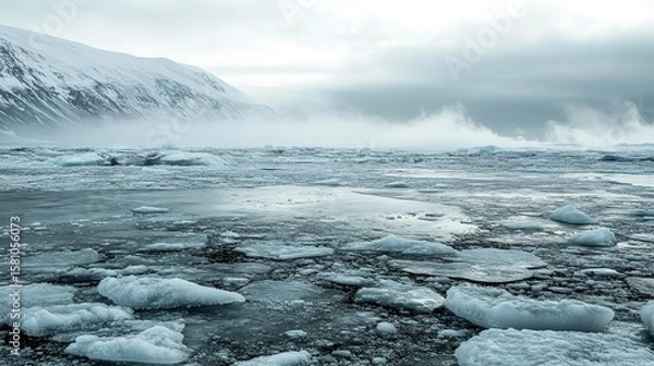 Fototapeta Melting ice sheet with scattered dark dust, symbolizing the urgent impact of environmental change.