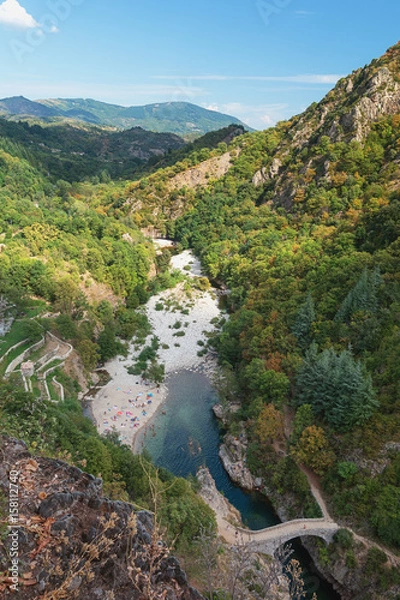 Fototapeta The Pont du Diable or Devil Bridge is a Roman bridge that spans the river Ardeche at about 10 m altitude.