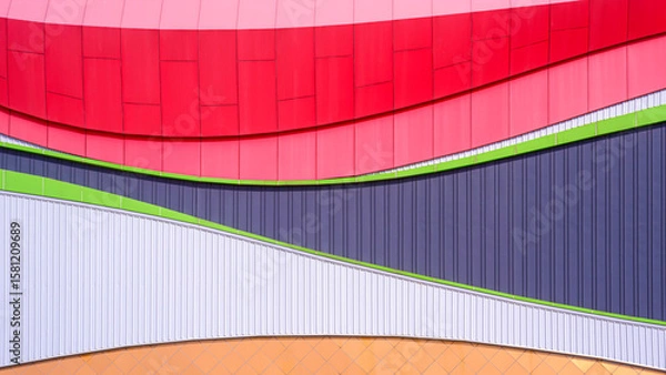 Fototapeta Modern geometric exterior building wall decoration background with colorful corrugated steel and aluminium composite tile abstract curve pattern in minimal design