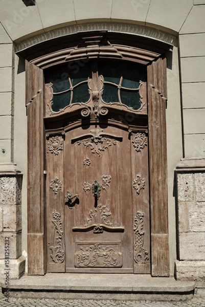 Fototapeta An Intricate and Beautiful Antique Wooden Door Adorned with a Decorative Design that Captivates
