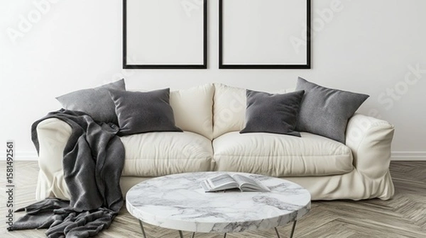 Obraz Cream-colored sofa with gray cushions and a throw blanket.