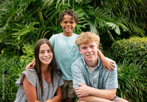 Obraz Casual Portrait of a diverse group of beautiful children. Cute smiling faces of hispanic girl, African American boy and caucasian boy.