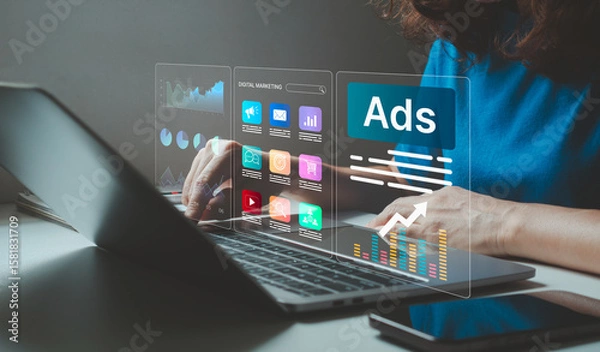 Fototapeta Businesswoman using laptop for digital marketing strategy and online advertising analysis. Concept of social media marketing, e-commerce promotion, branding, data analytics, technology in cyberspace.