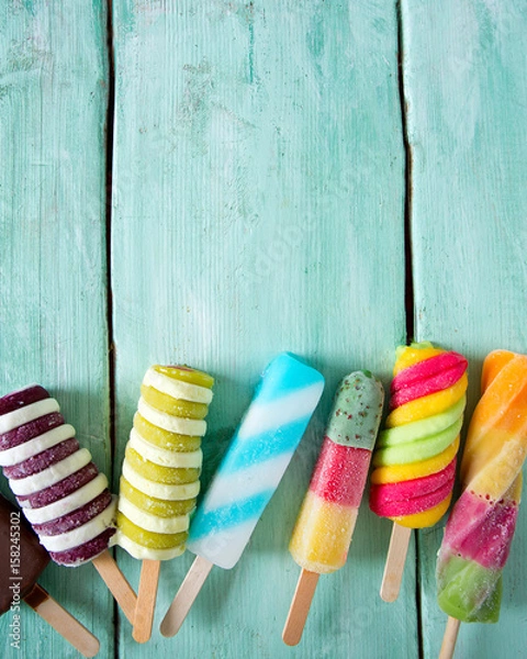 Obraz colorful popsicle ice cream on turquoise wooden background