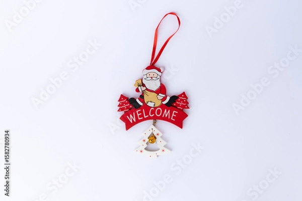 Obraz Festive Christmas decoration isolated on white background with greeting text Merry Christmas and Happy New Year. Perfect for holiday cards and seasonal designs.