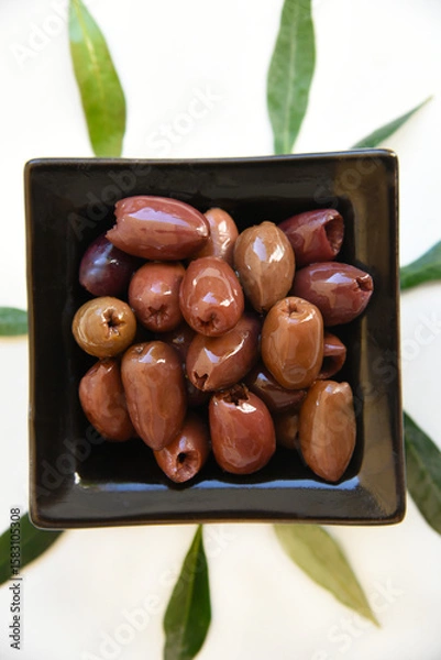 Obraz Rich and fruity Kalamata pitted olives from Greece are naturally brined to perfection. Their deep purple color and robust flavor make them ideal for salads, mezze, or a healthy Mediterranean snack.