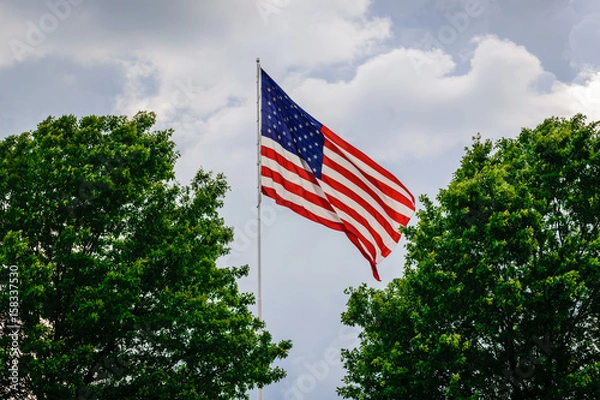 Fototapeta Flag pole in the sky with clouds