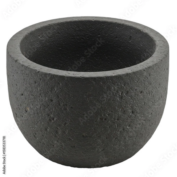 Obraz Round black stone planter with a textured surface, placed on a wooden table in a bright room