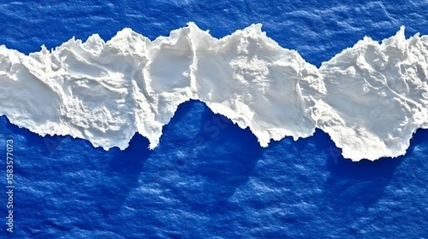 Obraz White torn paper on a deep blue surface