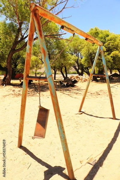 Obraz Rusty broken swing