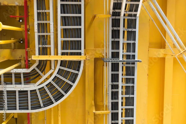 Fototapeta Cable tray with electrical wiring arrange on ceiling at offshore platform