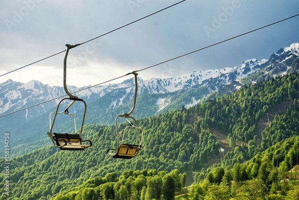 Fototapeta A canopy chairlift in the background of the mountains in the summer. Rosa Khutor, Adler