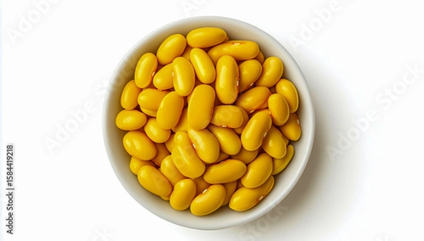 Fototapeta Top view of a bowl filled with yellow beans isolated on white background, with clipping path, high-resolution close-up, clean and minimal composition.