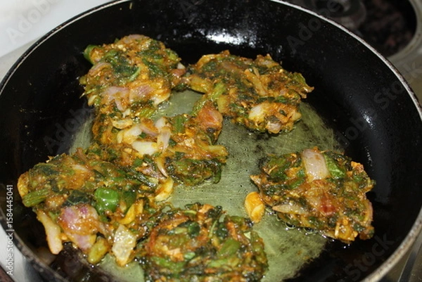 Obraz frying pan with fried pakauda.