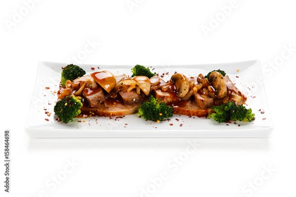 Fototapeta Grilled meat with broccoli and mushrooms on white background
