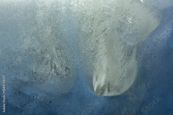 Obraz Abstract of ice on a cliff looks like diving seals.