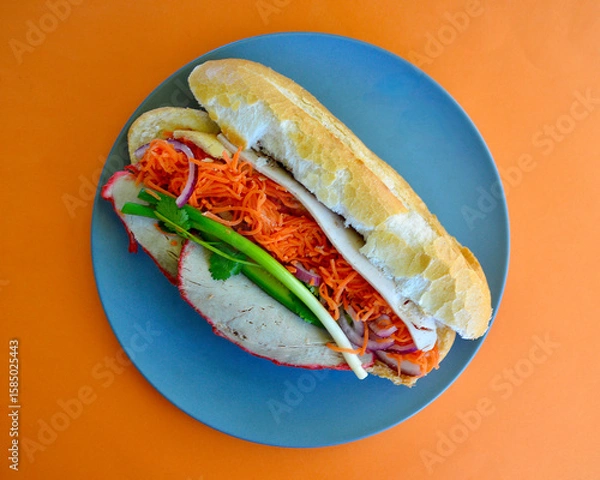 Fototapeta A Vietnamese style roll with salad on a plate. 