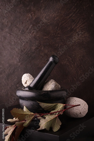 Fototapeta Mortaio in pietra con elementi naturali, still life con spazio per testo