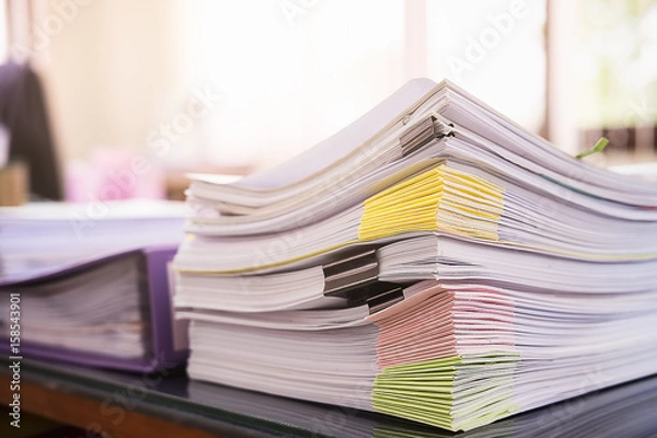 Obraz Close up Pile of unfinished business documents on office desk, Stack of business paper.Select focus.