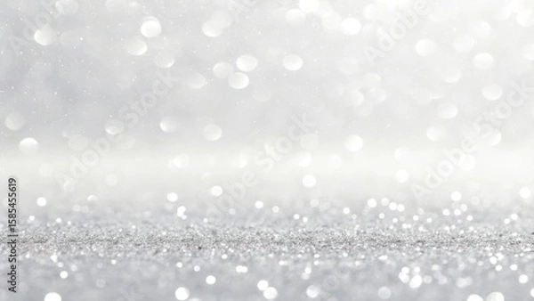 Fototapeta Sparkling silver glitter background with soft bokeh lights