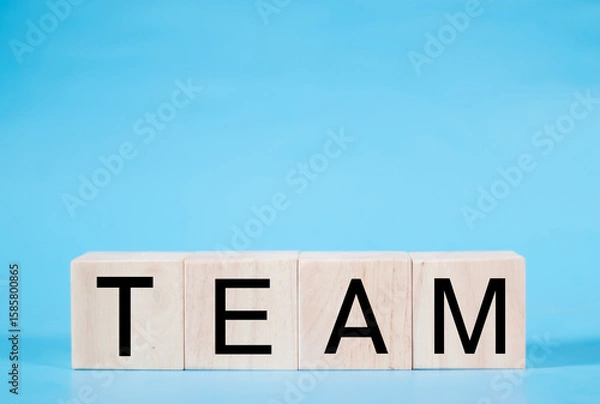 Fototapeta Word team on wooden block, relationship of collaboration and leadership for success, group of community and employee with corporate, teamwork for brainstorming together, no people, business concepts.