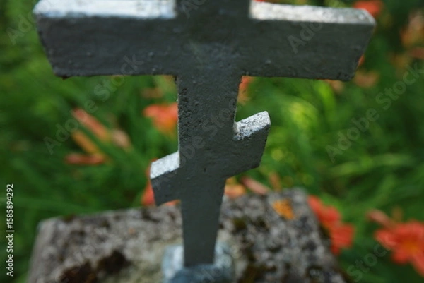 Fototapeta old cracked cross gravestone in cemetery