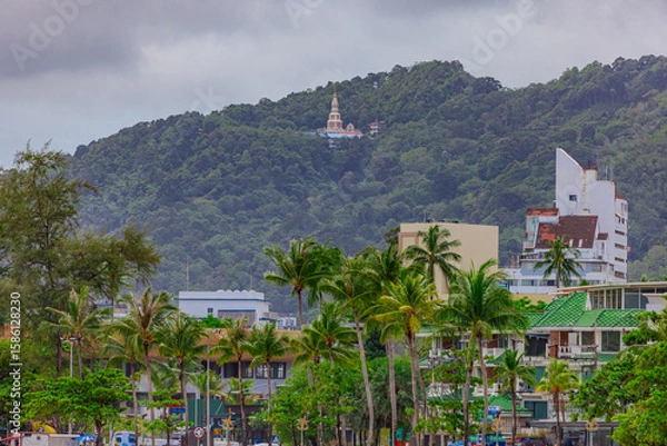 Fototapeta Panorama view of Patong beach with buildings Hotels and apartments and in the distance the Andaman blue sea. Patong is on the island of Phuket In Thailand.