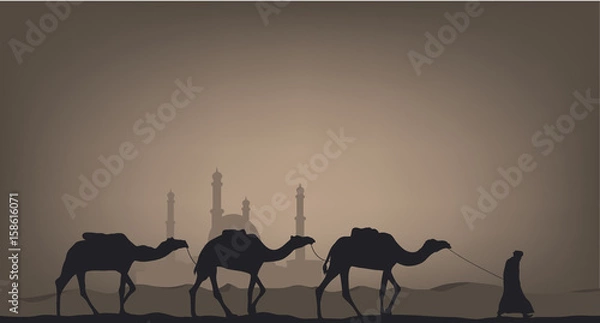 Fototapeta Camels in the desert against the background of the mosque.